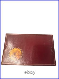 Colt handgun box, specifically identified as a maroon 150th-anniversary box