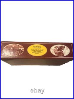 Colt handgun box, specifically identified as a maroon 150th-anniversary box